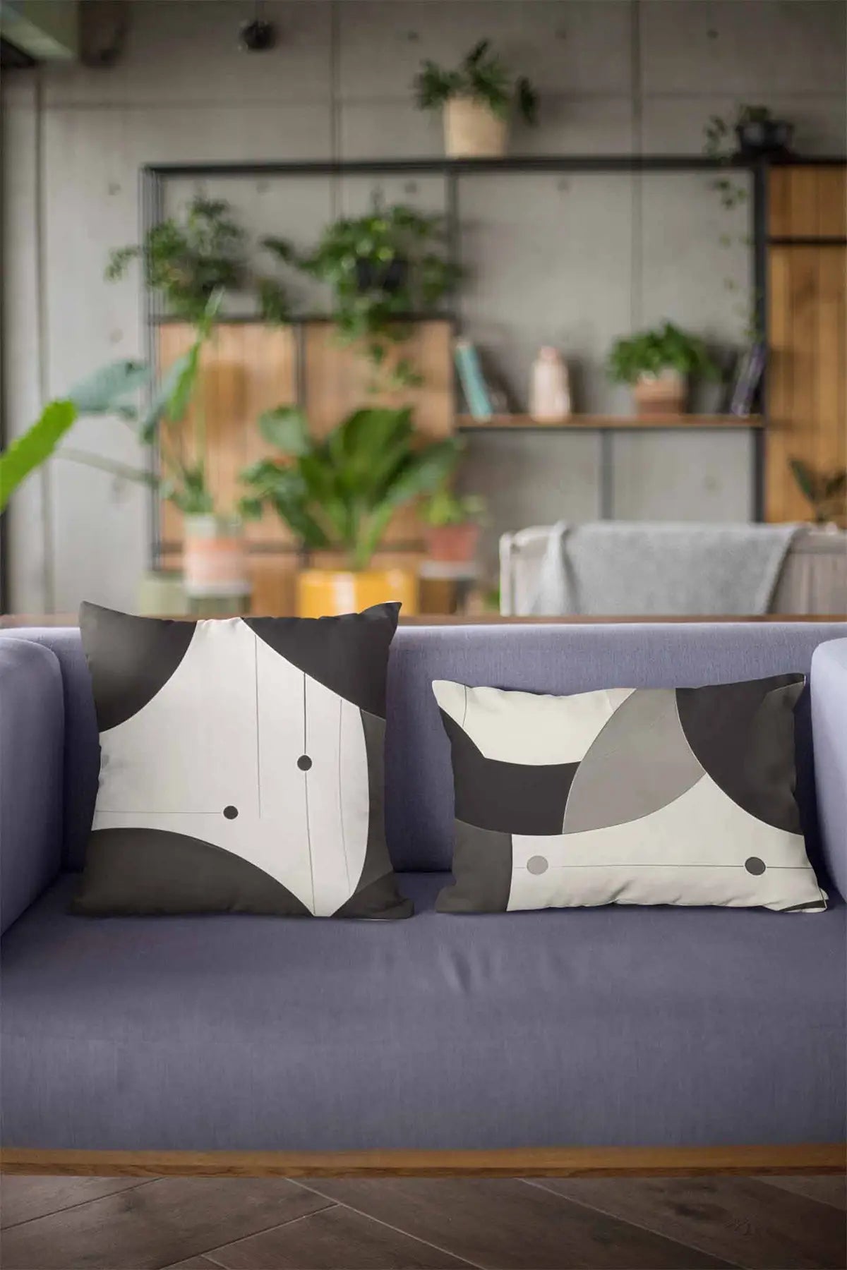 Overlapping Circles digital art printed on two pillows on a couch, adding modern wall art and contemporary art to your home decor.