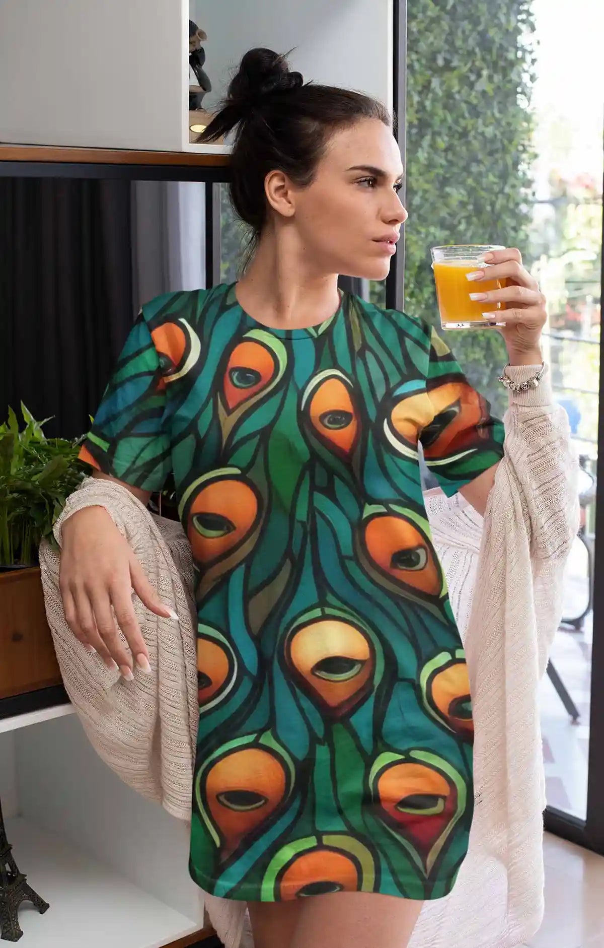 Peacock 1 digital art print on a nightdress, featuring a woman drinking orange juice, showcasing vibrant stained glass peacock contemporary art
