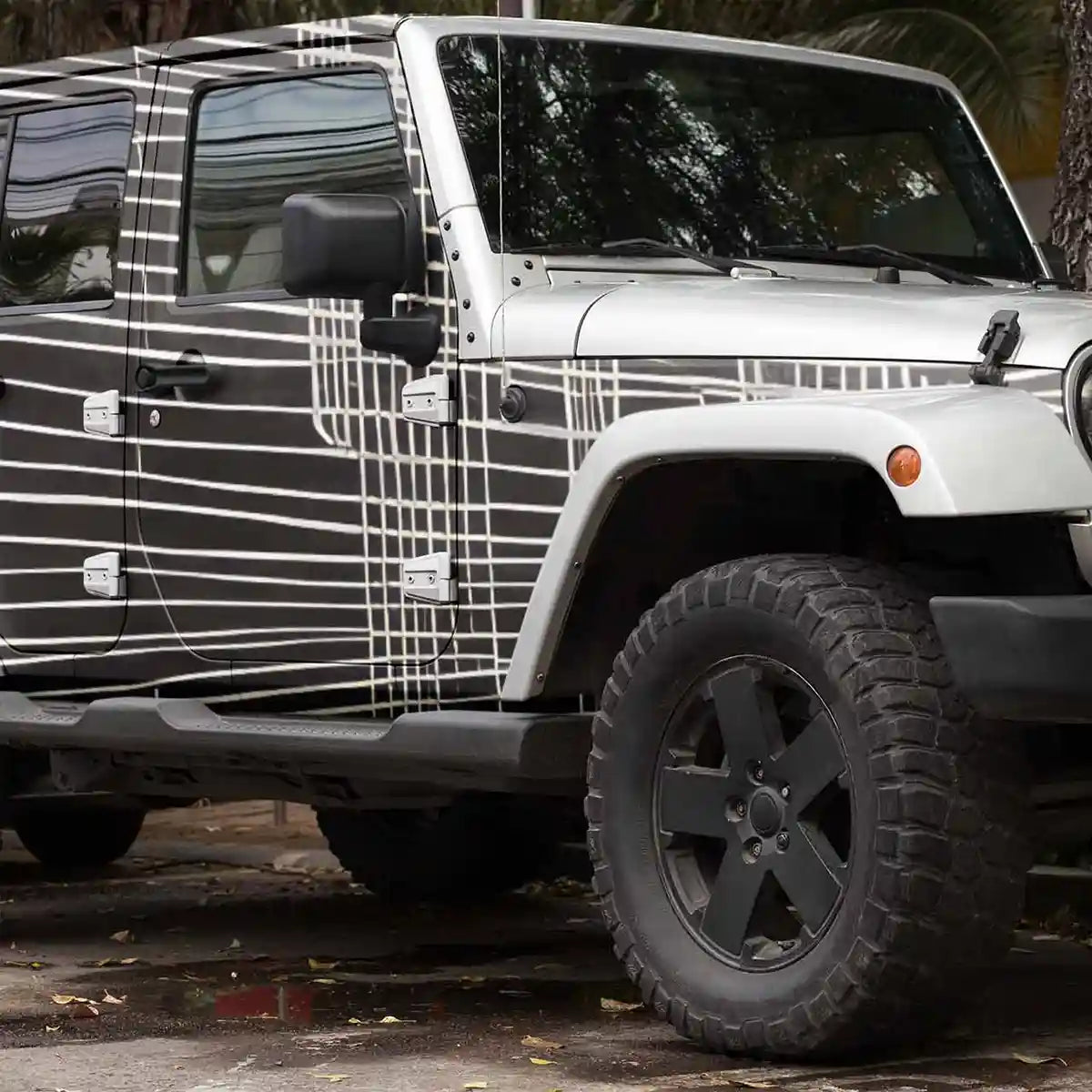 Soulprint digital art print on a car decal placed on an off-road truck, showcasing intricate geometric patterns and abstract art design, enhancing the vehicle's appearance.