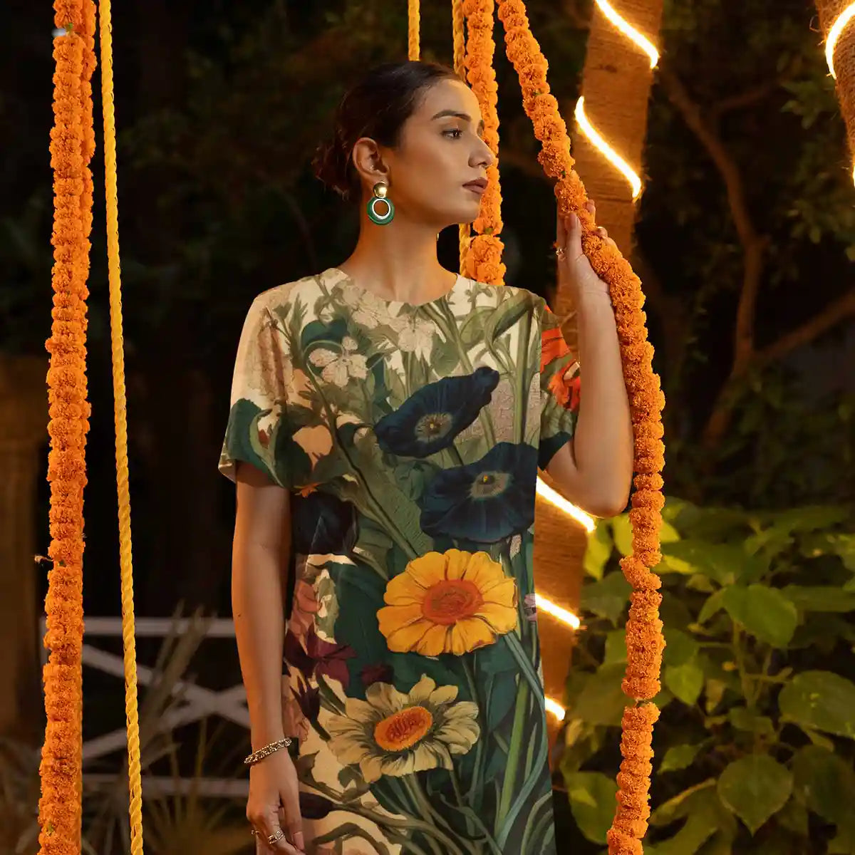 Botany Continuum digital art print on T-shirt dress worn by a woman posing with Diwali-themed decorations.