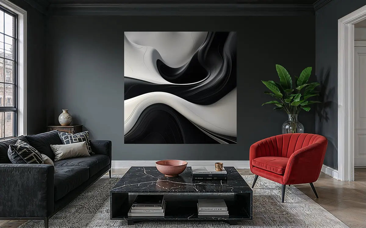 Modern living room with abstract art, black sofa, red chair, and marble coffee table.