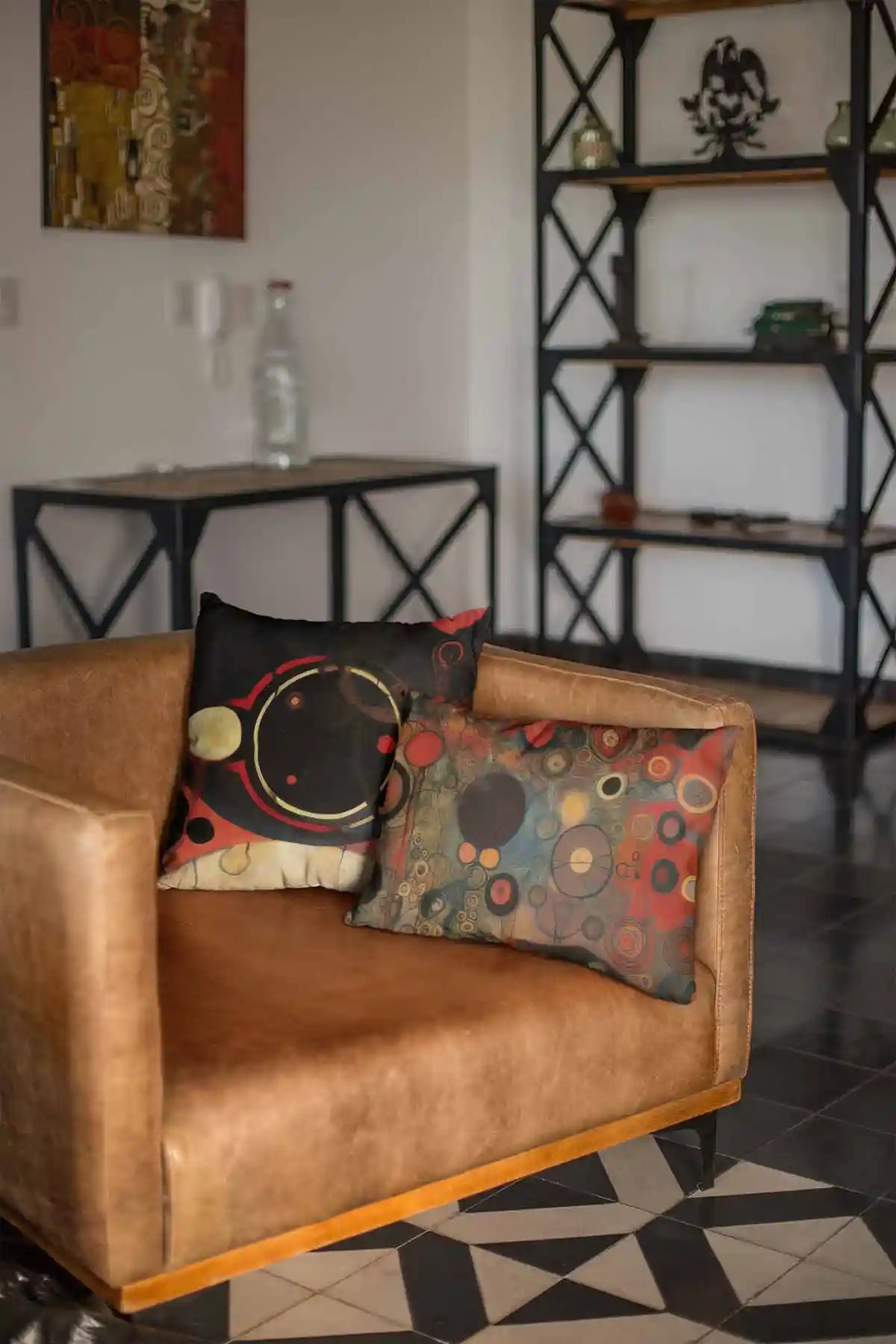 Conflated Serenade digital art print on two throw pillows on a leather couch.