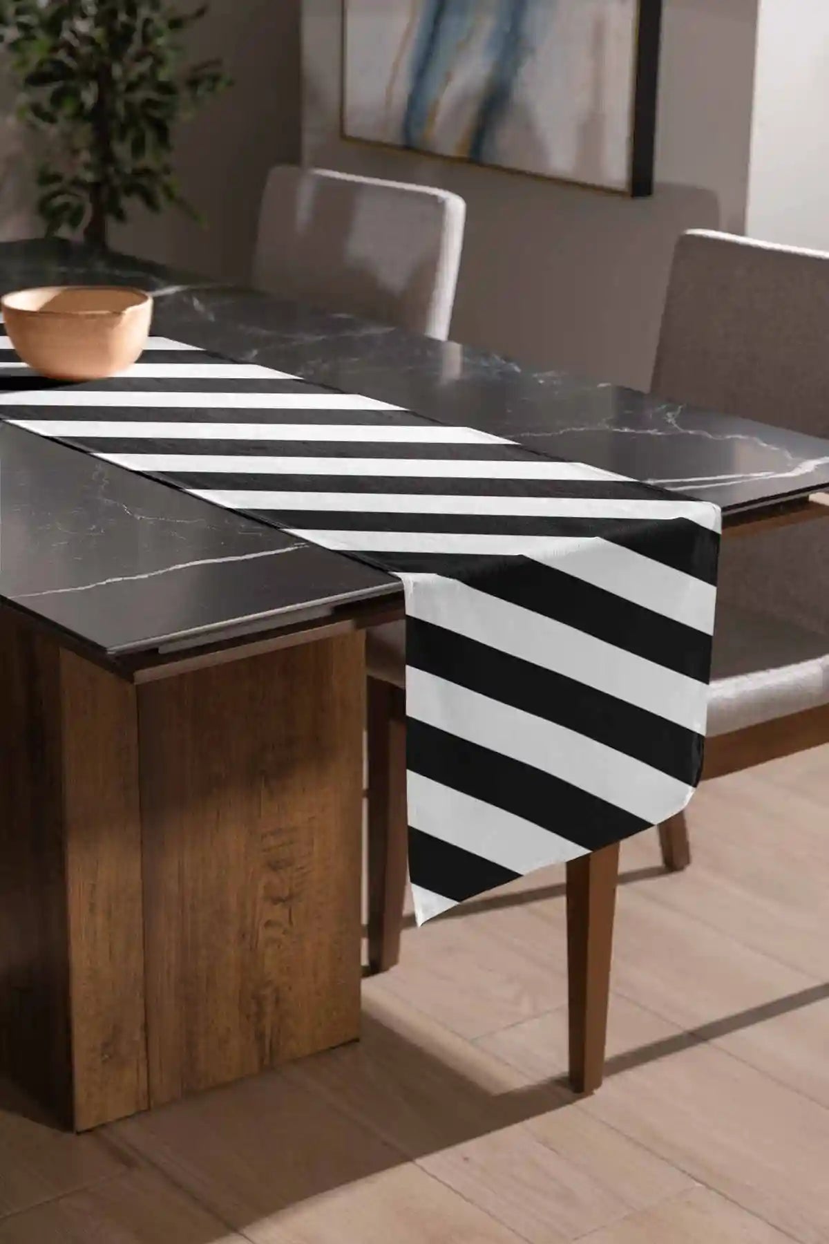 Diagonal Stripes digital art print on a sublimated table runner placed on a marble table.