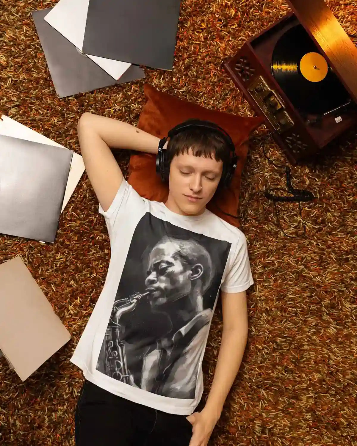 Jazz Musician digital art print on a T-shirt featuring a person listening to music surrounded by vinyl records.
