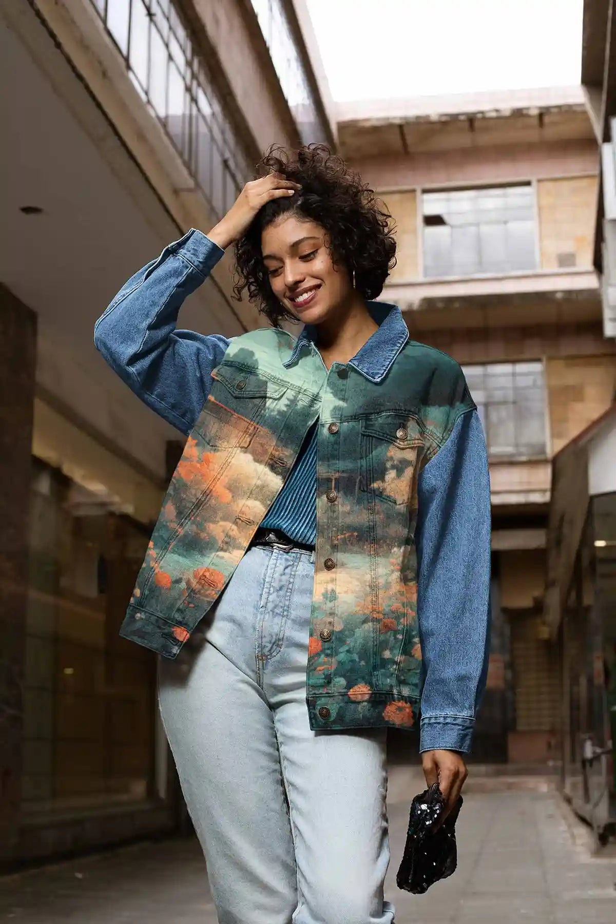 Memo digital art print on a denim jacket featuring a smiling woman holding her hair, adding a stylish and artistic touch to her outfit.