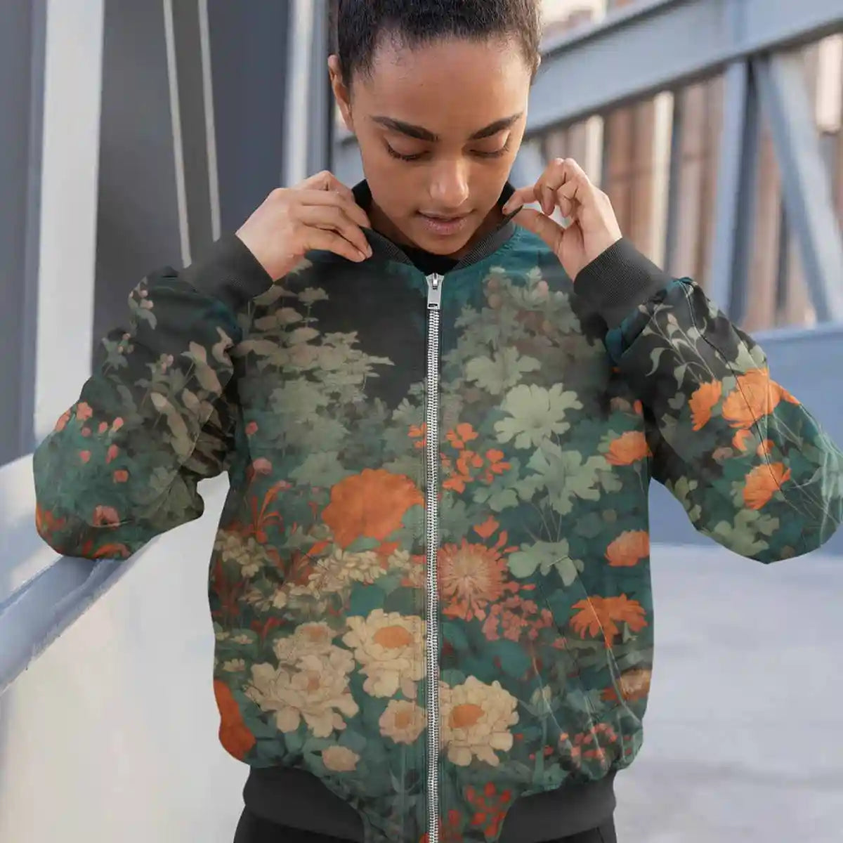 Woman with hair bun wearing bomber jacket featuring Midnight Garden digital art print.
