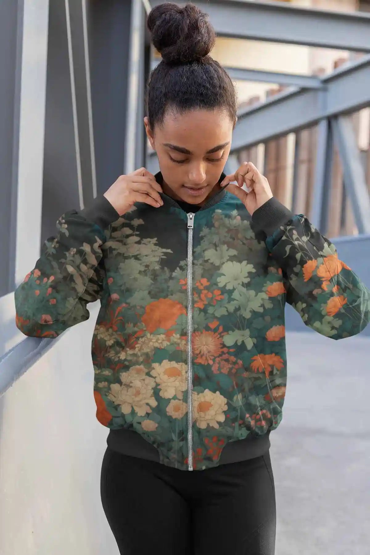 Midnight Garden digital art print on a sublimated bomber jacket featuring a woman with a hair bun, showcasing a serene garden with vibrant flowers under moonlight.
