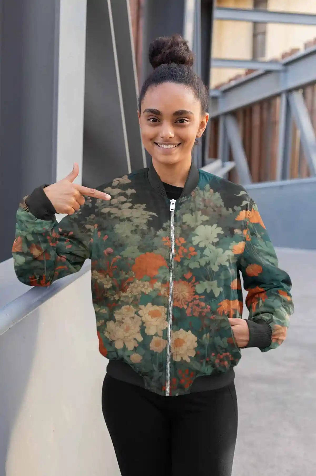 Midnight Garden digital art print on a bomber jacket featuring a woman pointing at her jacket, showcasing a serene garden scene under moonlight.