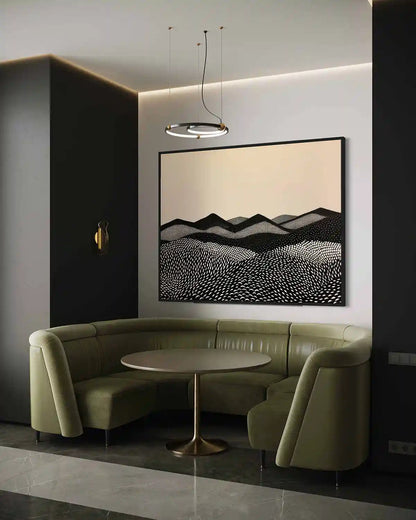 Modern interior with a green curved sofa, round table, and abstract oversized Mountains digital art wall print.