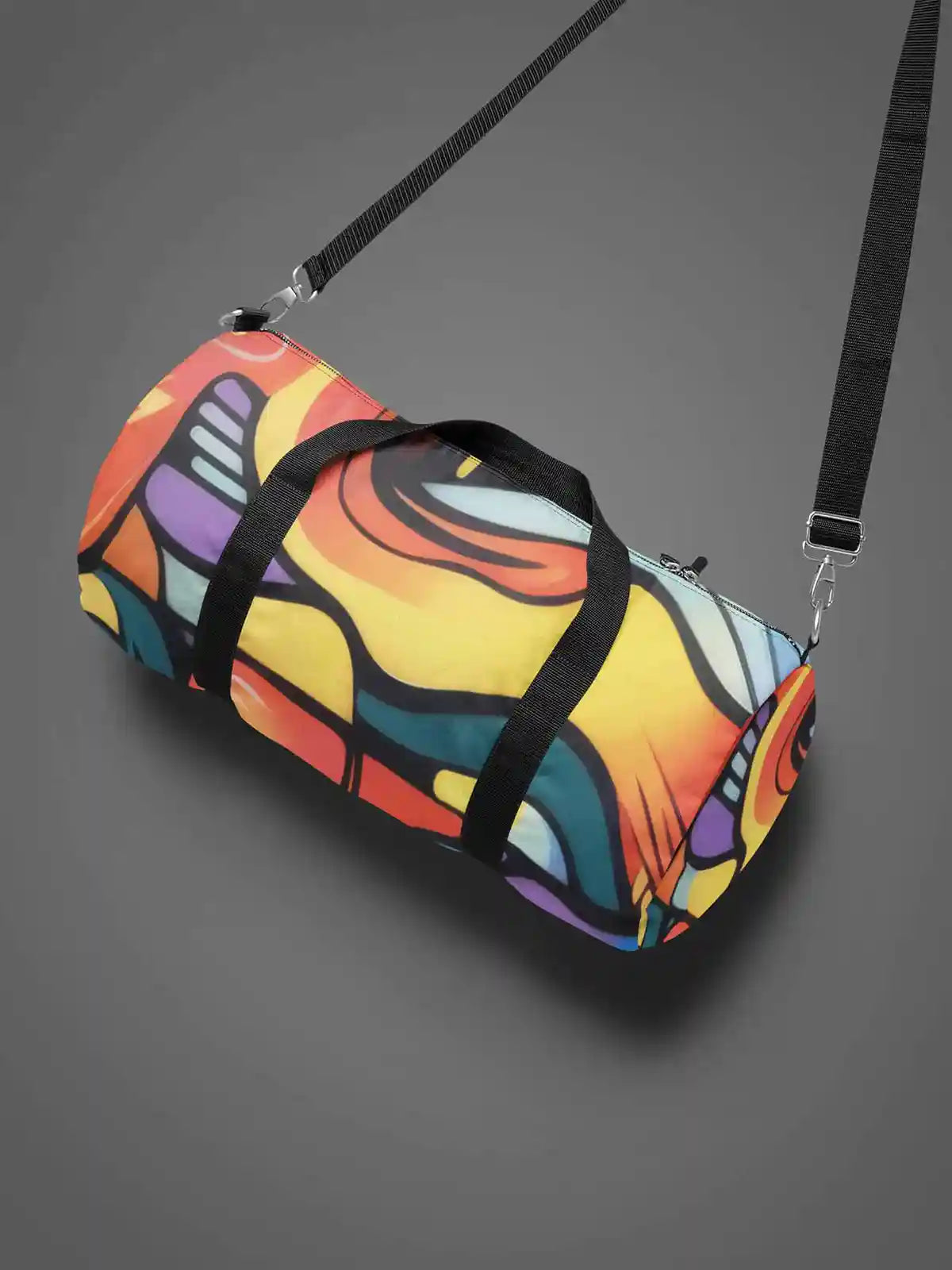 Multivue digital art print on a duffle bag with a shoulder strap, featuring vibrant colors and dynamic abstract patterns.