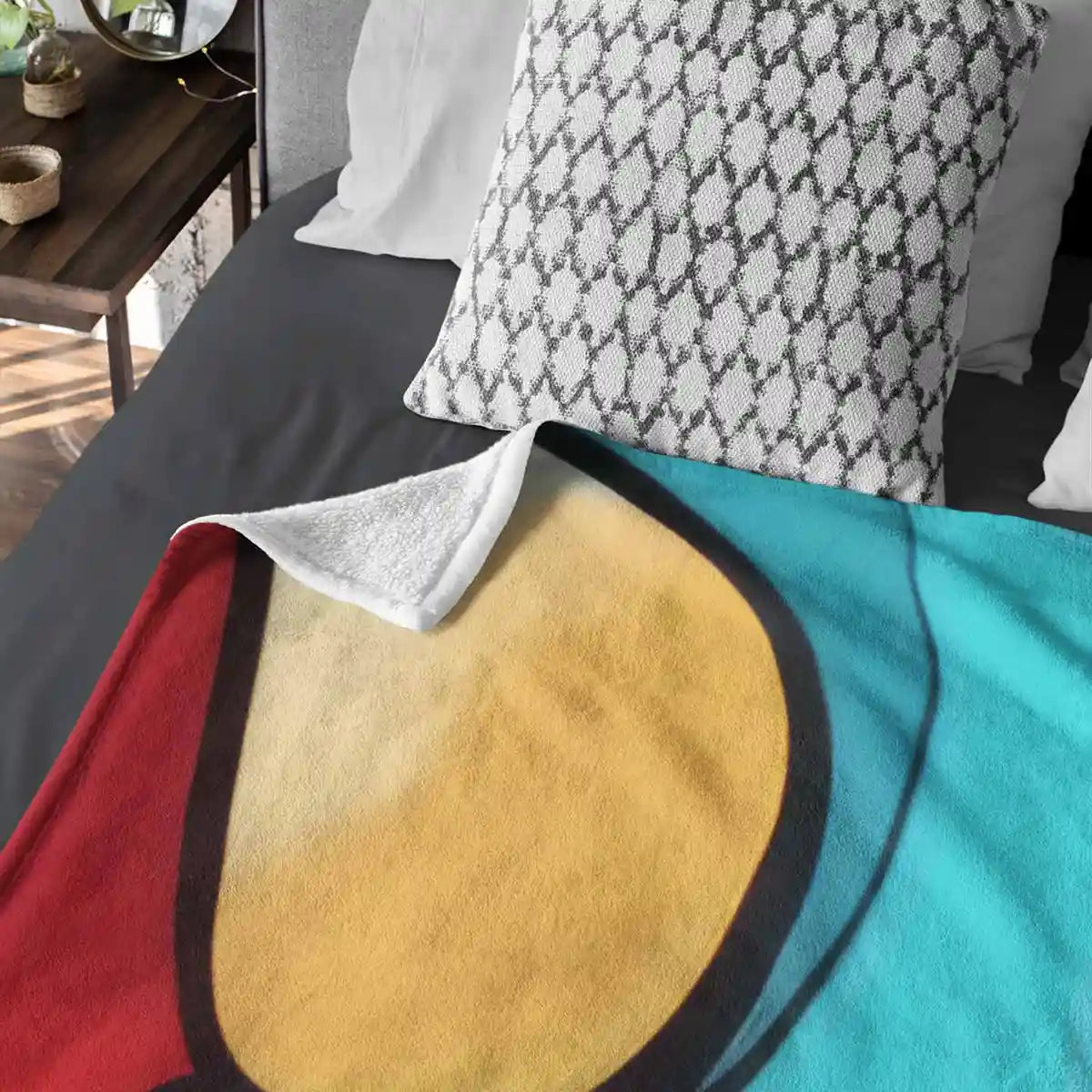 Bed with fleece blanket featuring Multivue digital art print design.