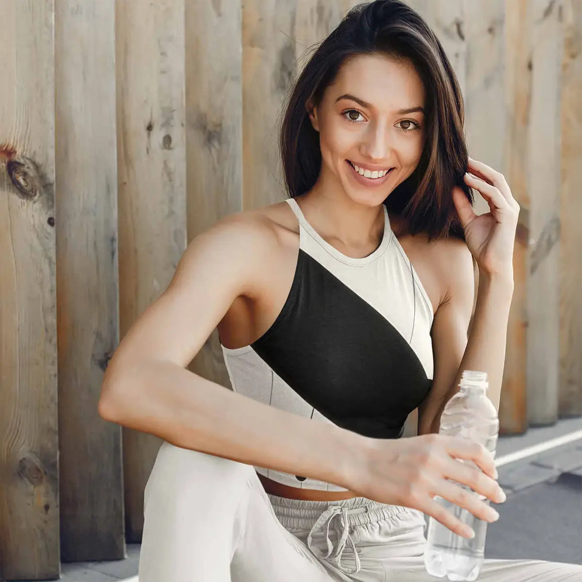Overlapping Circles digital art print on a sublimated crop top tank top, featuring a happy woman wearing the top, perfect for modern wall art and abstract art.