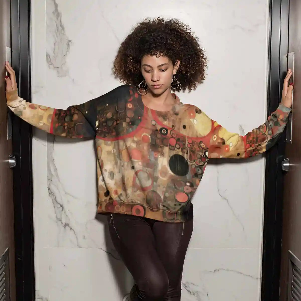 Sacred Serenade digital art print on a sublimated sweatshirt featuring a woman standing between two doors.