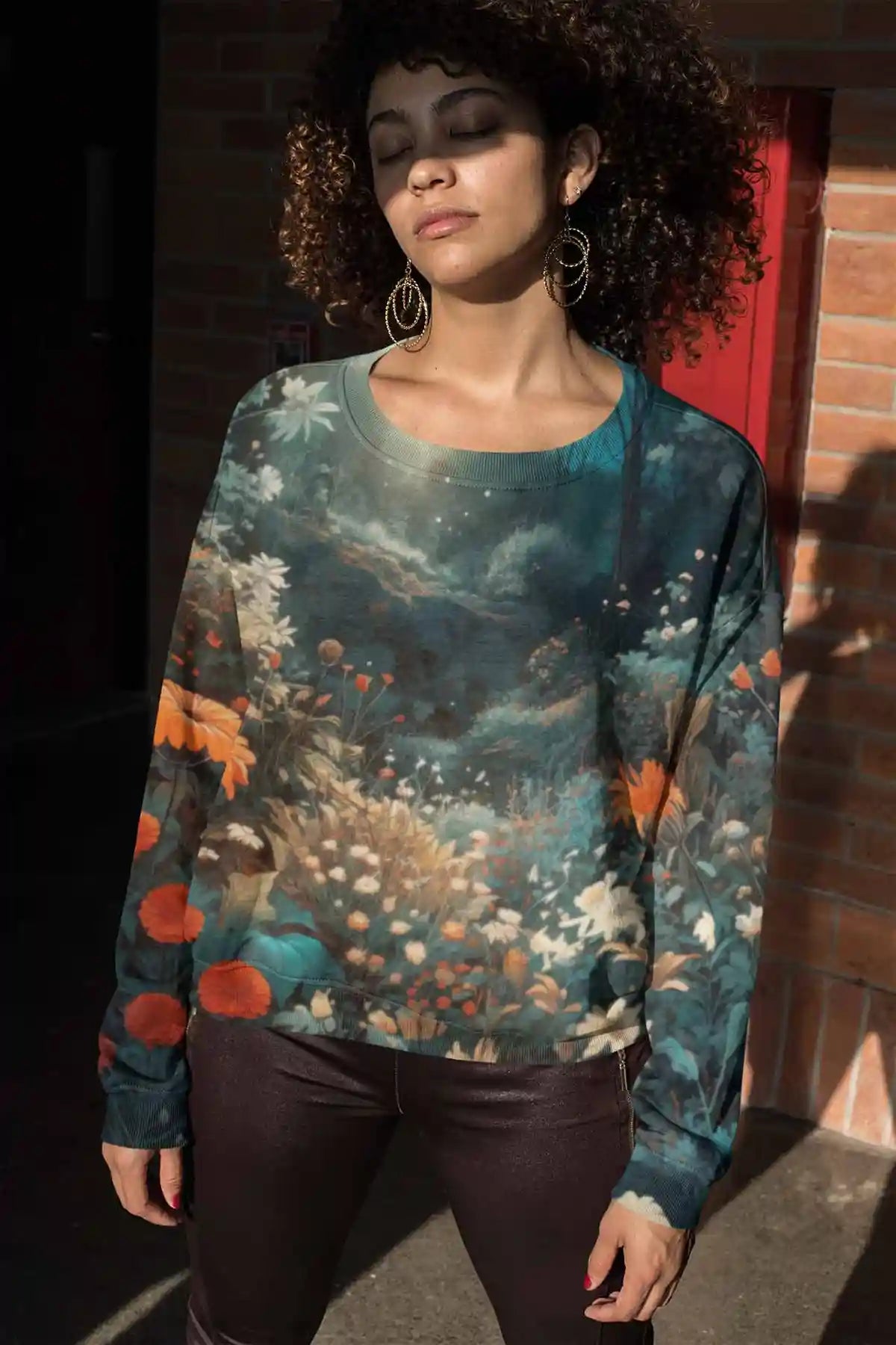 Silent Grove digital art print on a sublimated sweatshirt featuring a woman with closed eyes, displaying a serene forest scene with vibrant flowers, blending contemporary art with tranquility.