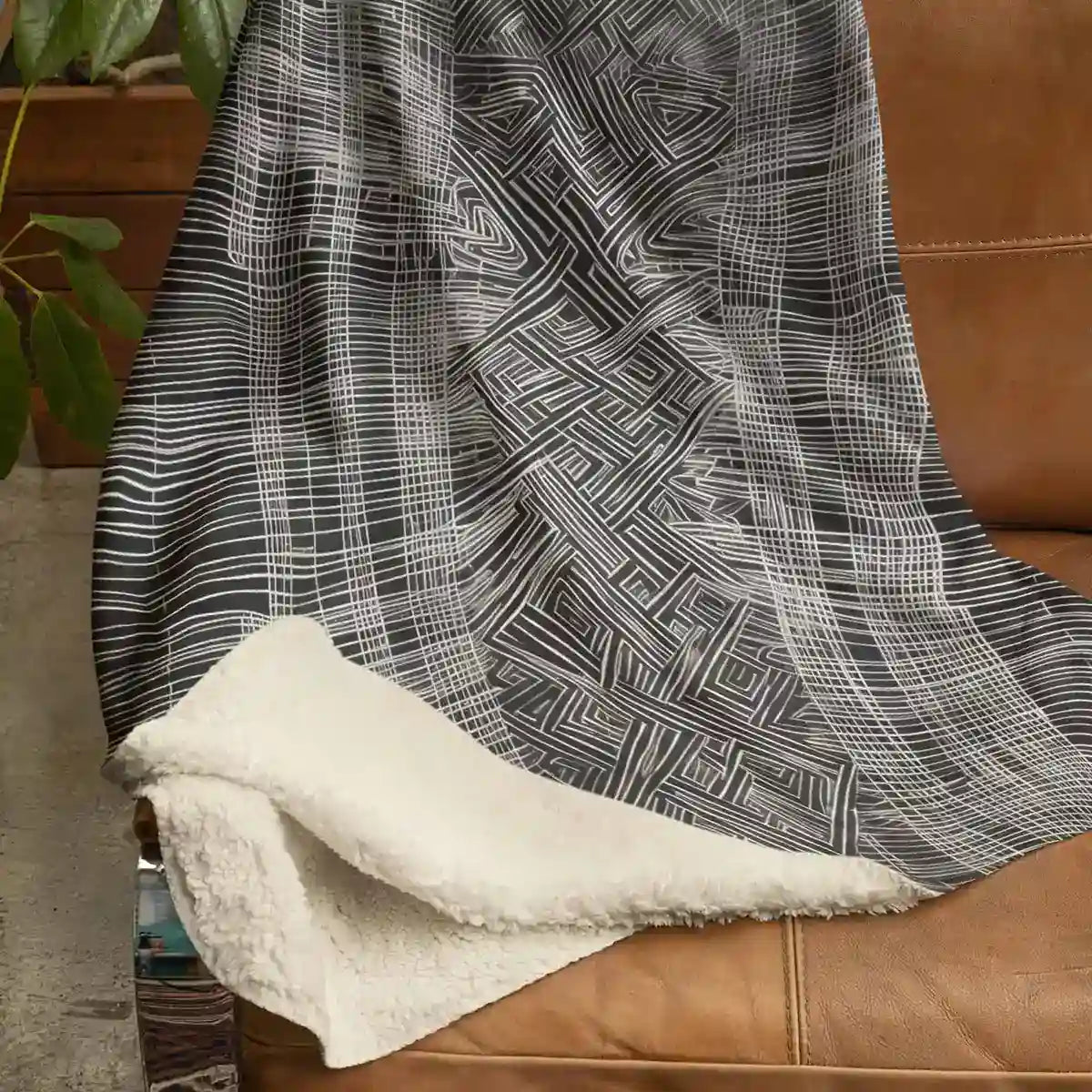 Sherpa fleece blanket with Soulprint digital art print draped on couch.