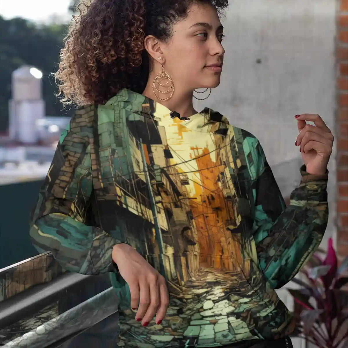 Sublimated hoodie featuring Street Shadows digital art print worn by woman on balcony.