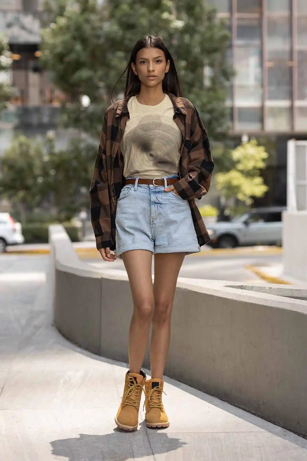 Woman walking in street wearing round neck tee with Tidal Orbits digital art print.
