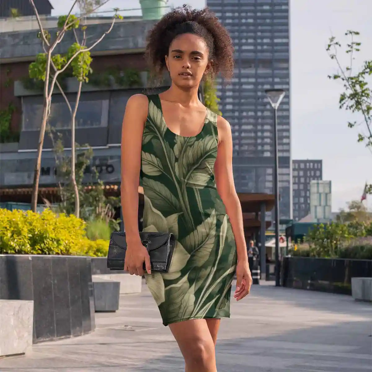 Fashionable woman walking in city wearing racerback dress with Verdant Melody digital art print.