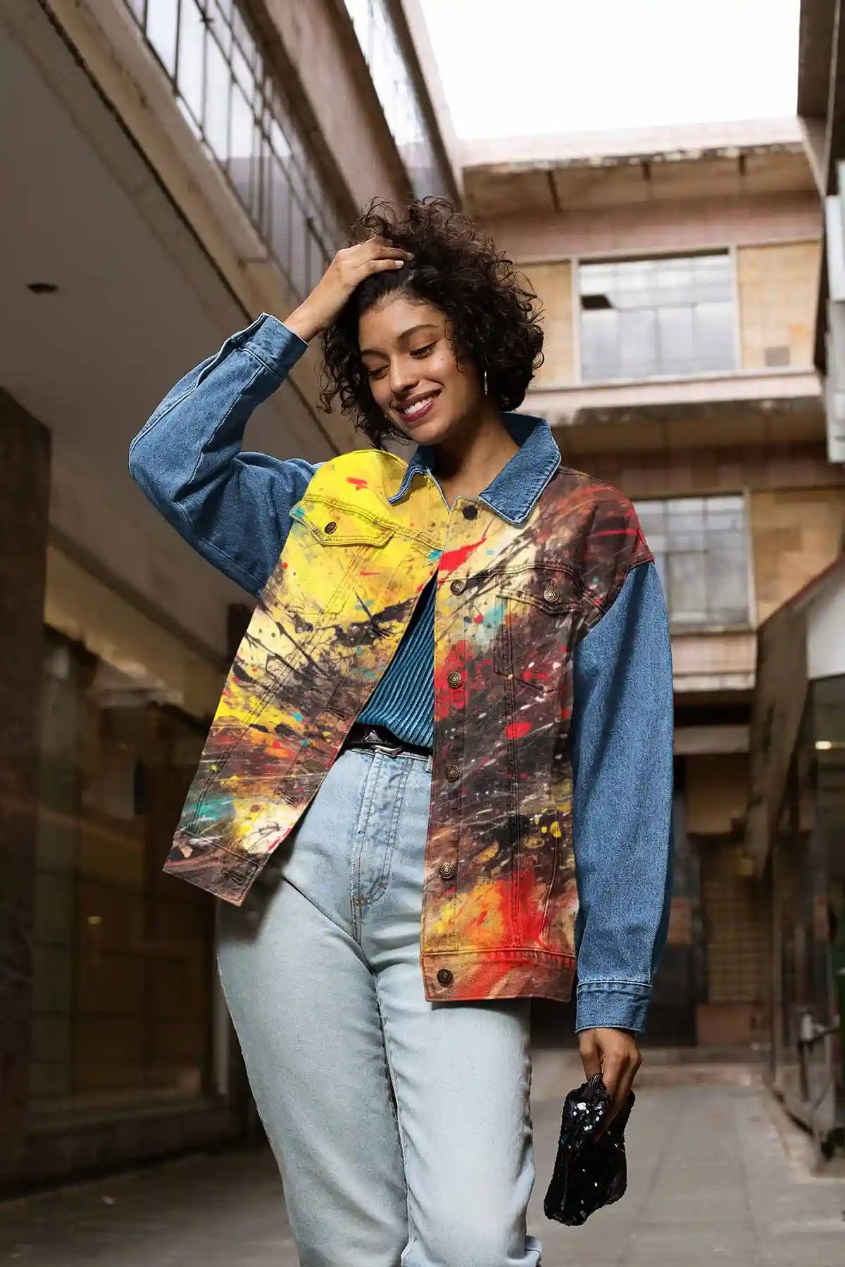 Vigor digital art print on a denim jacket featuring a smiling woman holding her hair, capturing vibrant energy and modern style
